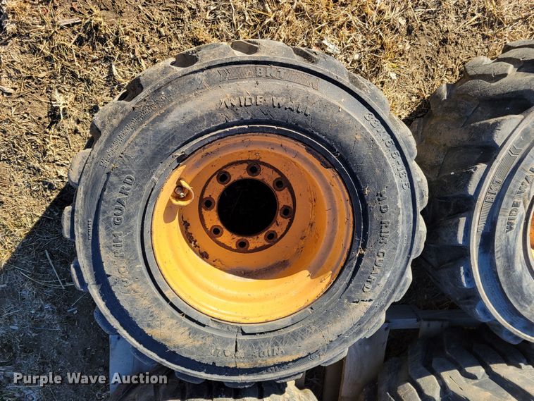 image for item MC9537 (4) 33x15.5-16.5 skid steer tires and wheels