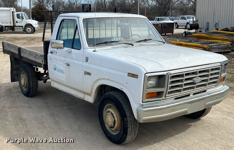 image for item KR9591 1984 Ford F250  flatbed pickup truck