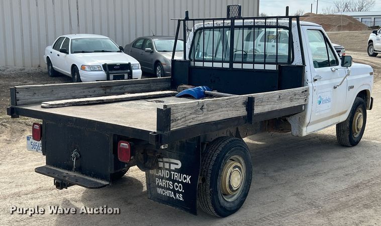 image for item KR9591 1984 Ford F250  flatbed pickup truck