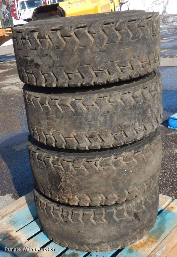 image for item DQ7297 (4) 12-16.5NHS skid steer tires and wheels