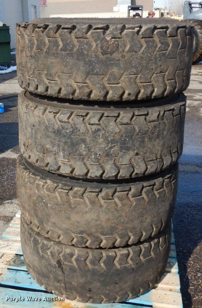 image for item DQ7297 (4) 12-16.5NHS skid steer tires and wheels