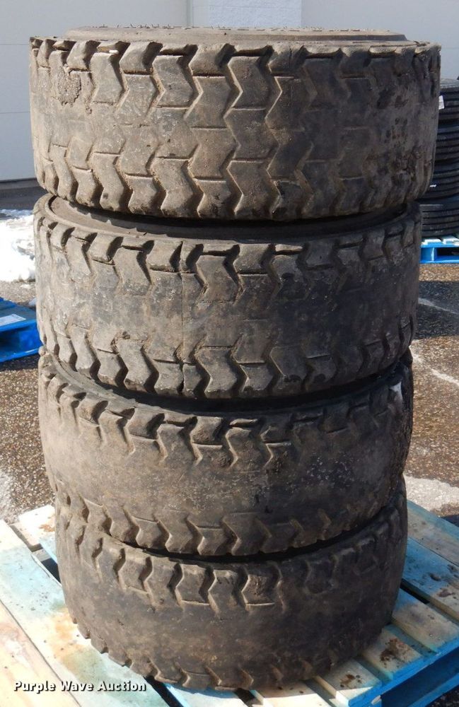 image for item DQ7297 (4) 12-16.5NHS skid steer tires and wheels