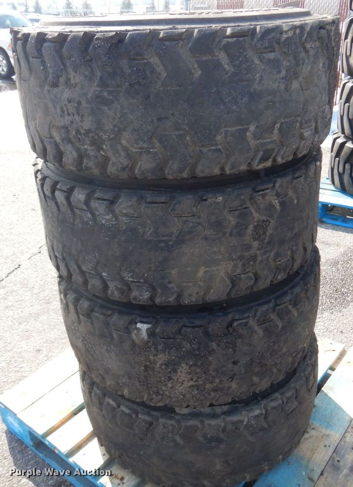 image for item DQ7297 (4) 12-16.5NHS skid steer tires and wheels