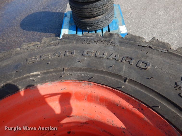 image for item DQ7297 (4) 12-16.5NHS skid steer tires and wheels