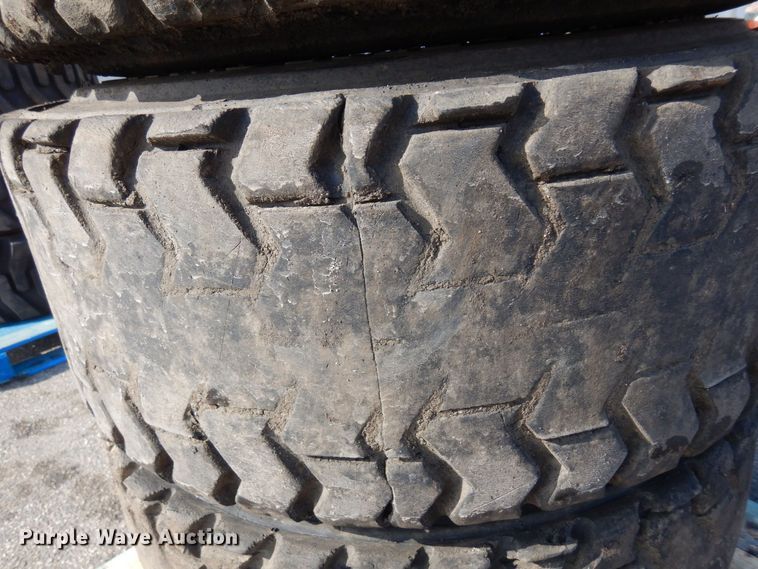 image for item DQ7297 (4) 12-16.5NHS skid steer tires and wheels