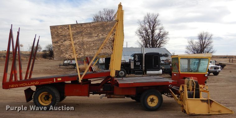 image for item DN6320 New Holland 1049  bale stacker