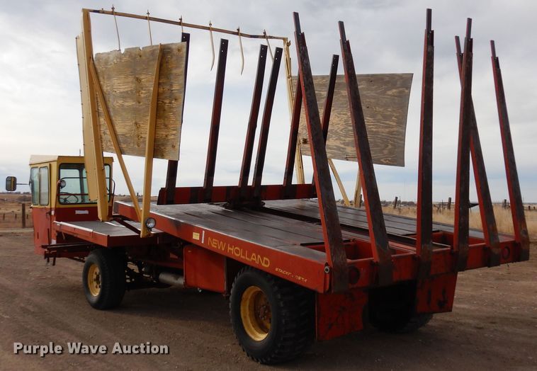 image for item DN6320 New Holland 1049  bale stacker