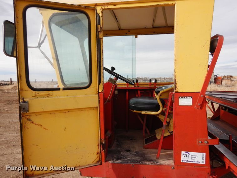 image for item DN6320 New Holland 1049  bale stacker