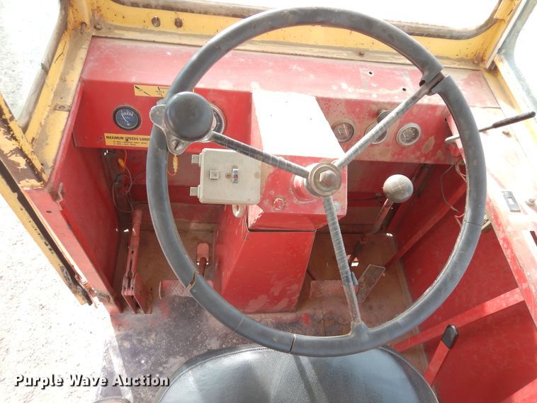 image for item DN6320 New Holland 1049  bale stacker