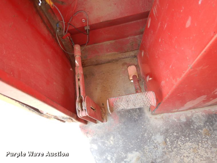 image for item DN6320 New Holland 1049  bale stacker