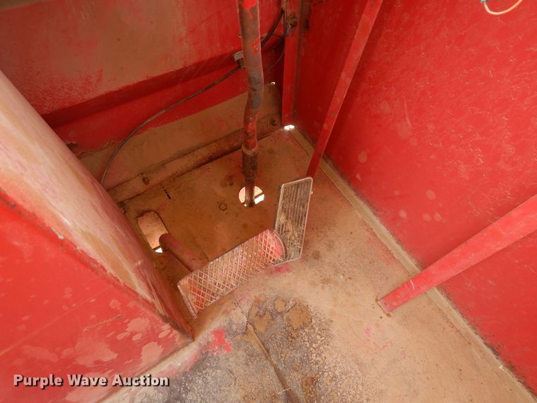 image for item DN6320 New Holland 1049  bale stacker