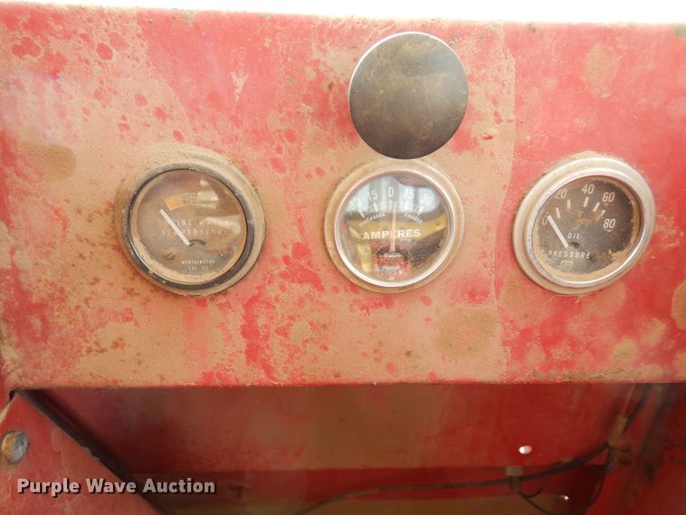 image for item DN6320 New Holland 1049  bale stacker