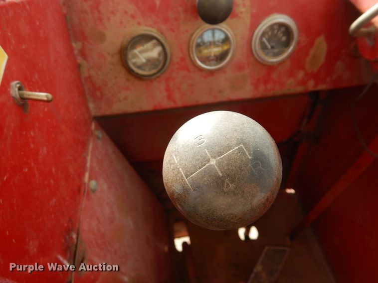 image for item DN6320 New Holland 1049  bale stacker