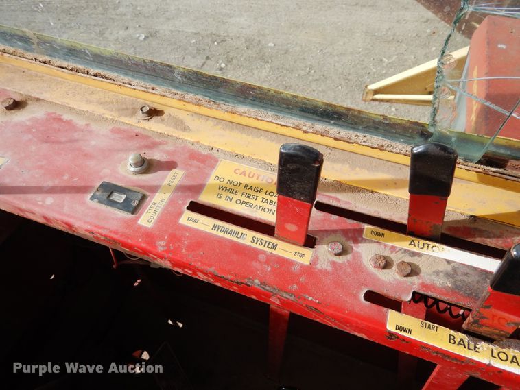 image for item DN6320 New Holland 1049  bale stacker