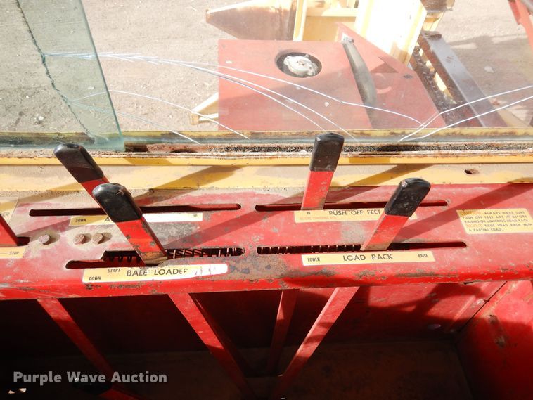 image for item DN6320 New Holland 1049  bale stacker