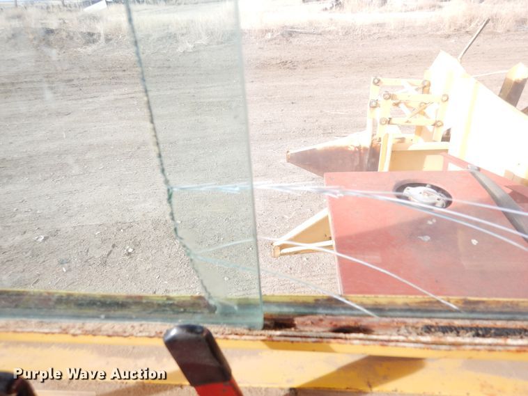 image for item DN6320 New Holland 1049  bale stacker