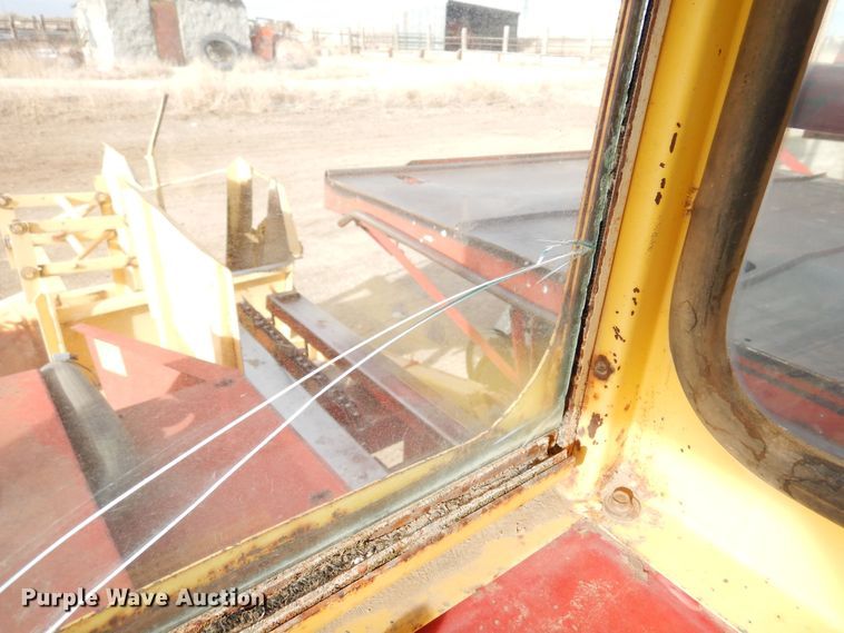 image for item DN6320 New Holland 1049  bale stacker