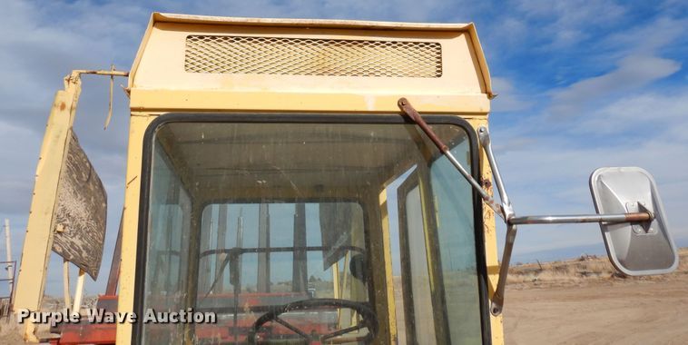 image for item DN6320 New Holland 1049  bale stacker