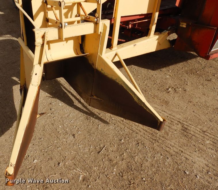 image for item DN6320 New Holland 1049  bale stacker