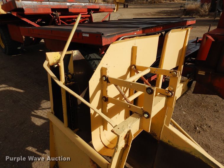 image for item DN6320 New Holland 1049  bale stacker