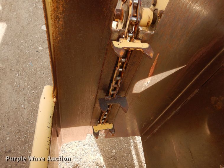 image for item DN6320 New Holland 1049  bale stacker