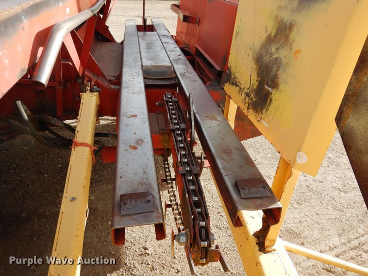 image for item DN6320 New Holland 1049  bale stacker