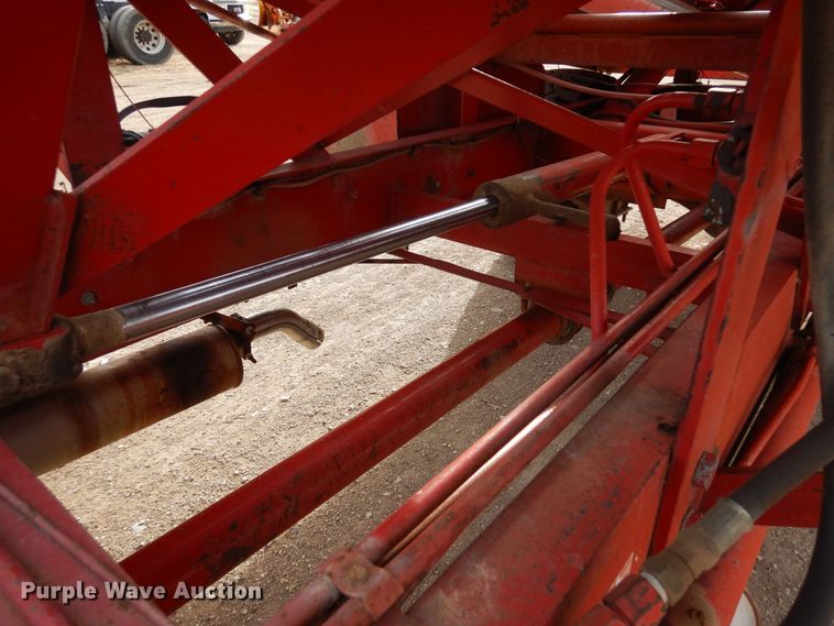 image for item DN6320 New Holland 1049  bale stacker