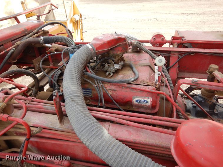 image for item DN6320 New Holland 1049  bale stacker