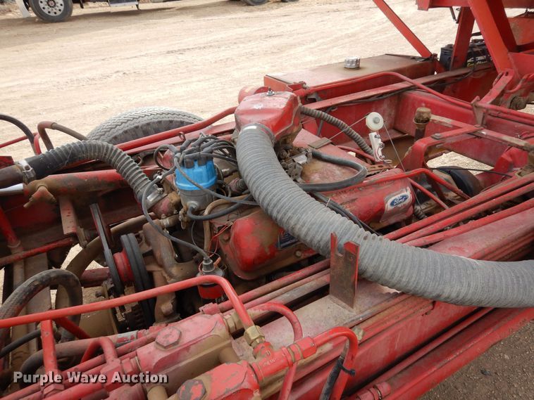 image for item DN6320 New Holland 1049  bale stacker