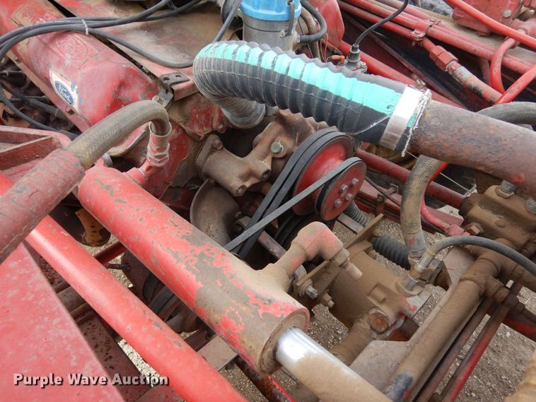 image for item DN6320 New Holland 1049  bale stacker