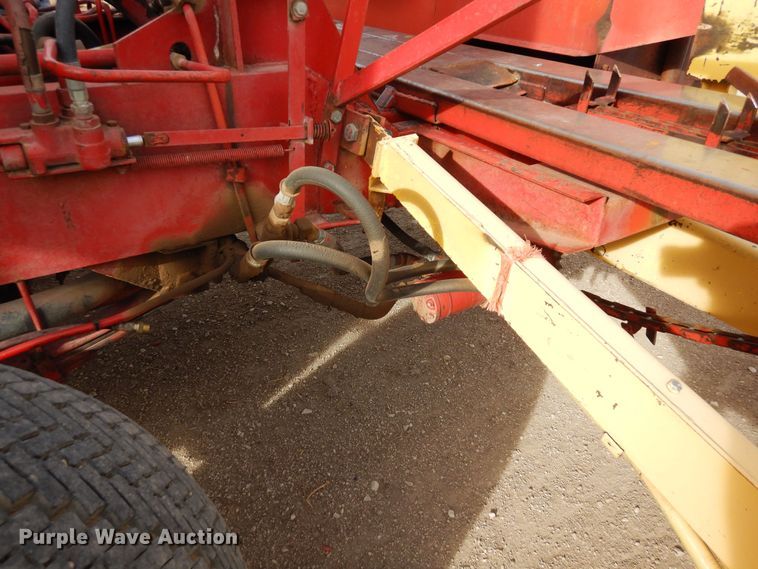 image for item DN6320 New Holland 1049  bale stacker