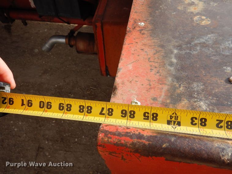 image for item DN6320 New Holland 1049  bale stacker