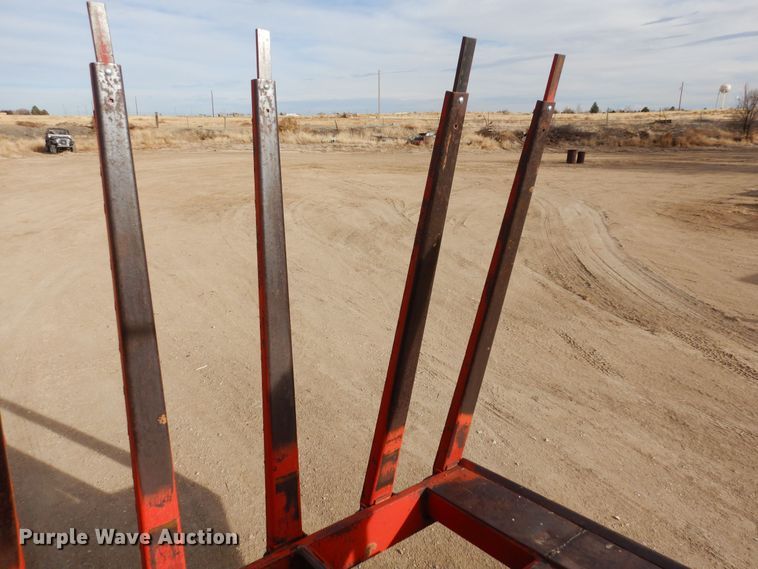 image for item DN6320 New Holland 1049  bale stacker