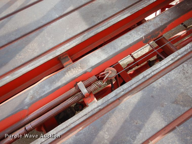 image for item DN6320 New Holland 1049  bale stacker