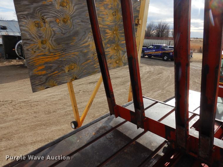 image for item DN6320 New Holland 1049  bale stacker