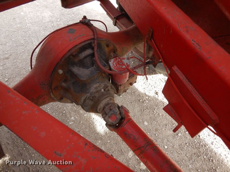 image for item DN6320 New Holland 1049  bale stacker