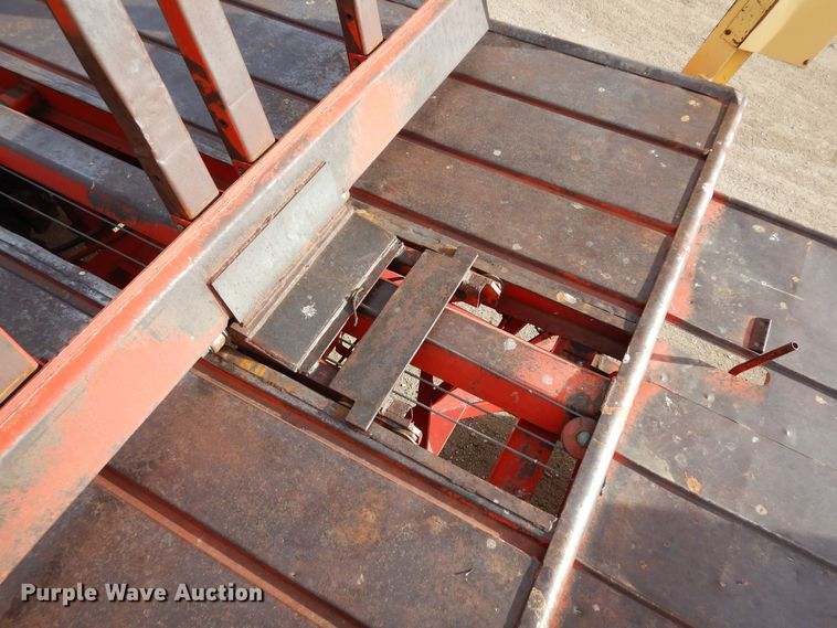 image for item DN6320 New Holland 1049  bale stacker