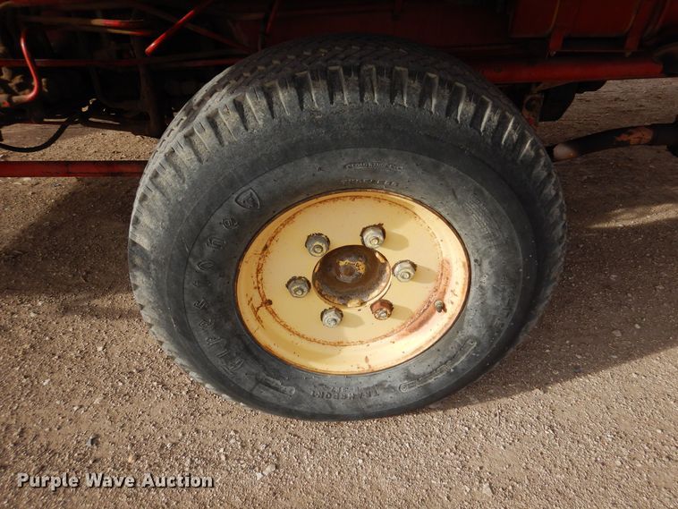 image for item DN6320 New Holland 1049  bale stacker