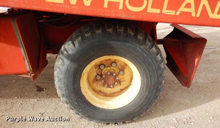 image for item DN6320 New Holland 1049  bale stacker