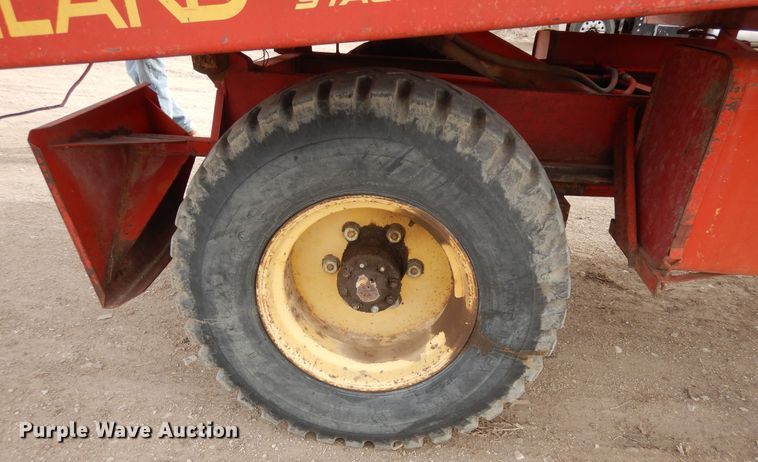 image for item DN6320 New Holland 1049  bale stacker