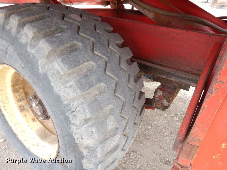 image for item DN6320 New Holland 1049  bale stacker