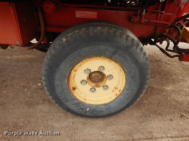 image for item DN6320 New Holland 1049  bale stacker