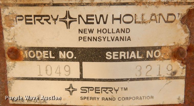 image for item DN6320 New Holland 1049  bale stacker