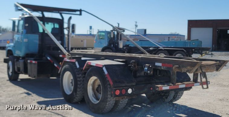 image for item MB9868 1997 Mack DM690S  roll-off container truck