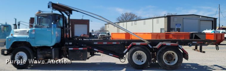 image for item MB9868 1997 Mack DM690S  roll-off container truck