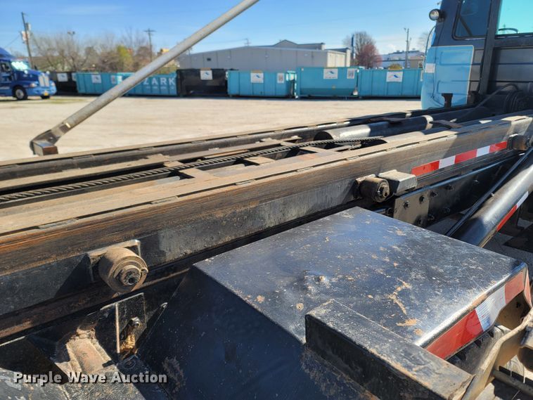 image for item MB9868 1997 Mack DM690S  roll-off container truck