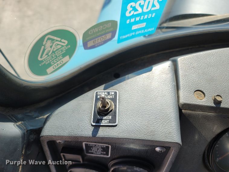 image for item MB9868 1997 Mack DM690S  roll-off container truck