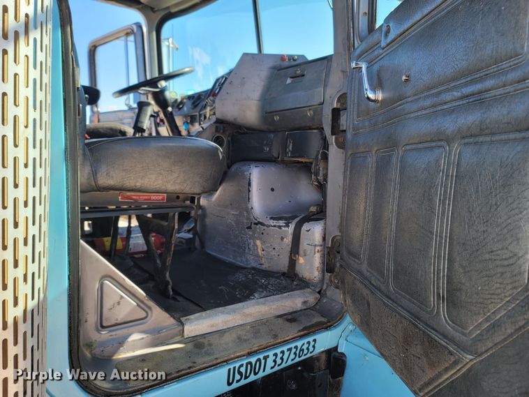 image for item MB9868 1997 Mack DM690S  roll-off container truck