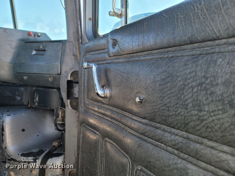 image for item MB9868 1997 Mack DM690S  roll-off container truck