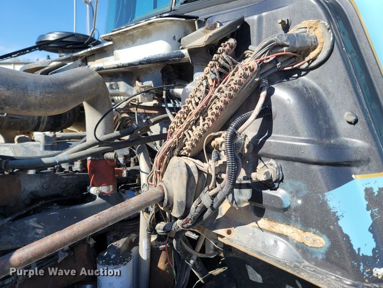 image for item MB9868 1997 Mack DM690S  roll-off container truck